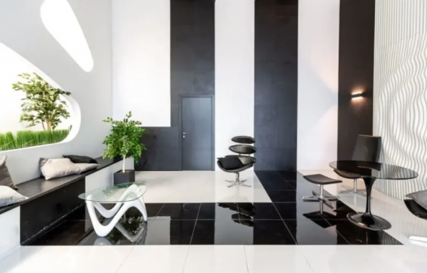 Cafe dengan konsep kontrast antara hitam dan putih yang menciptakan kesan dramatis